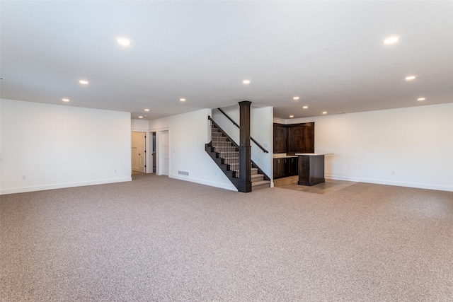 basement with light colored carpet