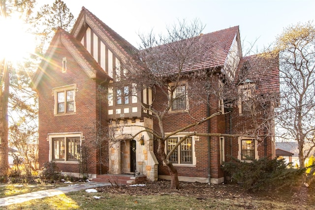 tudor home with brick siding