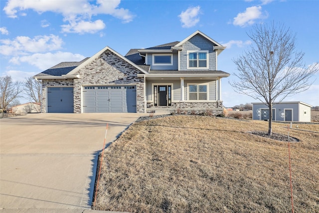 craftsman-style home with a garage and a front yard