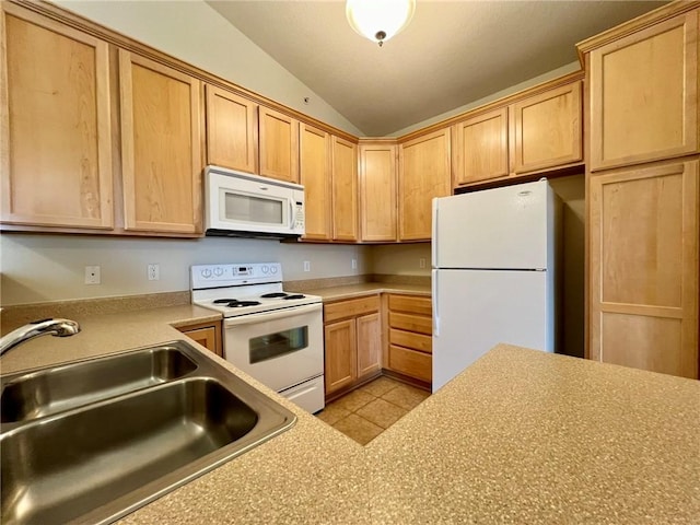 kitchen featuring vaulted ceiling, white appliances, sink, and light brown cabinets