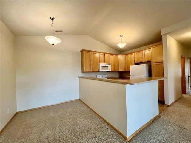 kitchen with light carpet, white appliances, decorative light fixtures, and kitchen peninsula