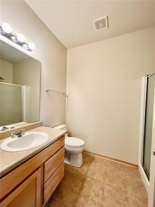 bathroom with walk in shower, vanity, and toilet