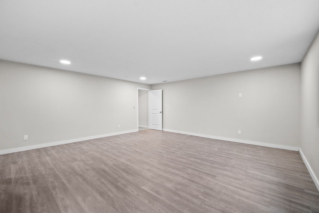 spare room with hardwood / wood-style flooring