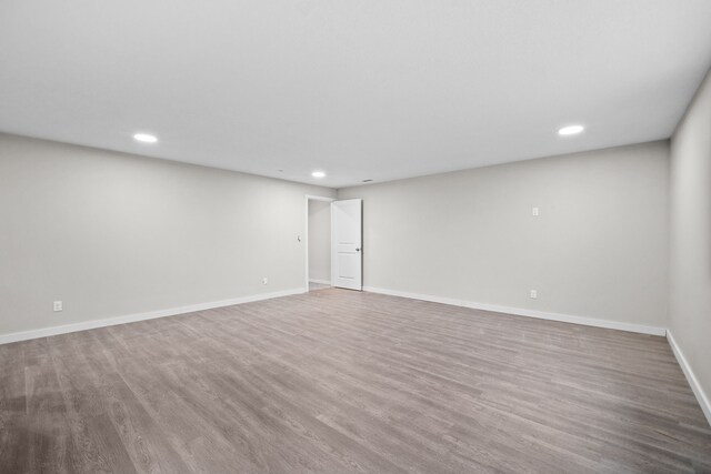 10431 Southerwick Pl, Johnston, IA 50131 - empty room with baseboards, wood finished floors, and recessed lighting