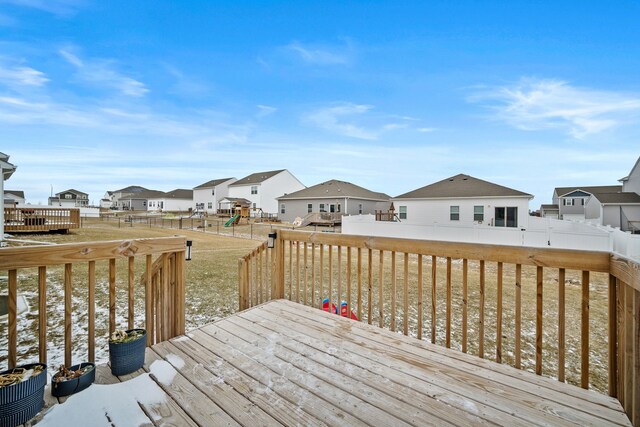 10431 Southerwick Pl, Johnston, IA 50131 - wooden deck with fence, a residential view, a playground, and a lawn