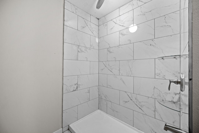 bathroom featuring tiled shower