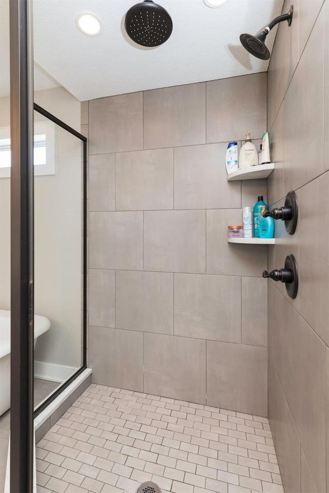 bathroom with a tile shower