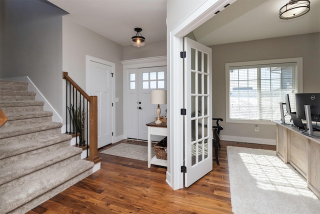 foyer with hardwood / wood-style flooring