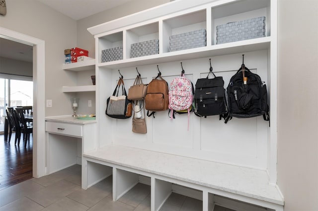 mudroom with light tile patterned floors