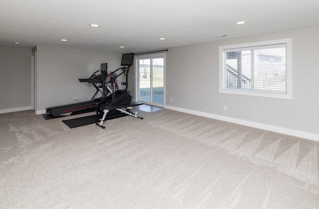 workout room featuring carpet