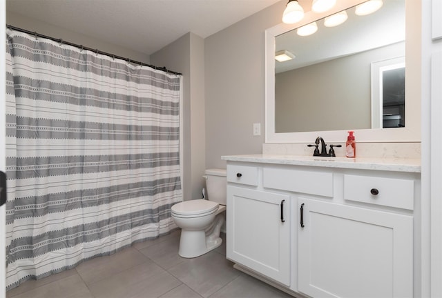 bathroom featuring vanity, a shower with shower curtain, tile patterned floors, and toilet