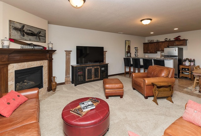 living room with light carpet and a fireplace