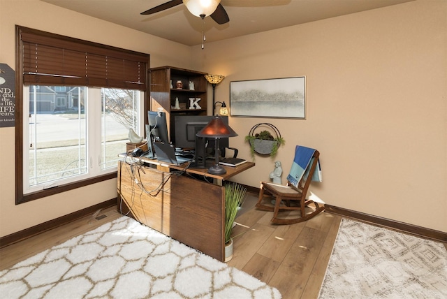 office area with hardwood / wood-style floors and ceiling fan