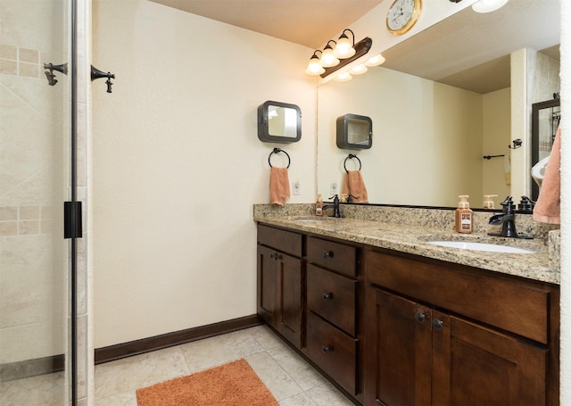 bathroom with vanity and tile patterned flooring