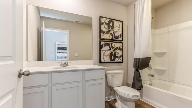 full bathroom with shower / bath combination with curtain, vanity, toilet, and hardwood / wood-style flooring