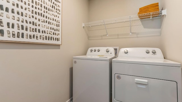 washroom featuring washer and dryer