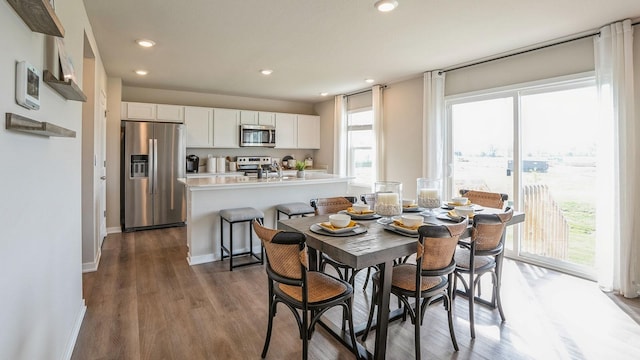 dining space featuring dark hardwood / wood-style floors