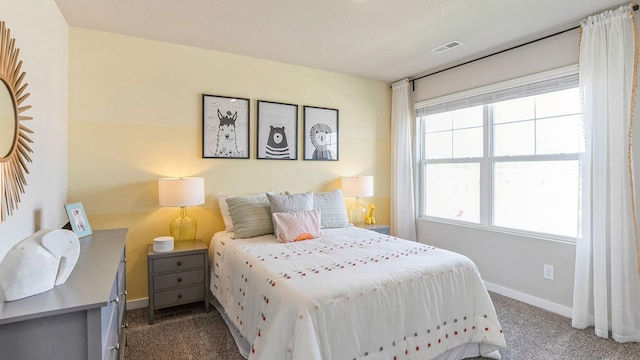 bedroom featuring dark carpet