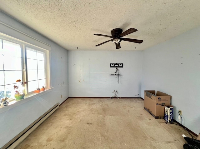 carpeted spare room with ceiling fan, a textured ceiling, and a baseboard heating unit