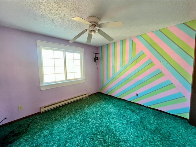 carpeted empty room with ceiling fan, a baseboard radiator, and a textured ceiling