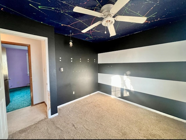 carpeted empty room with ceiling fan