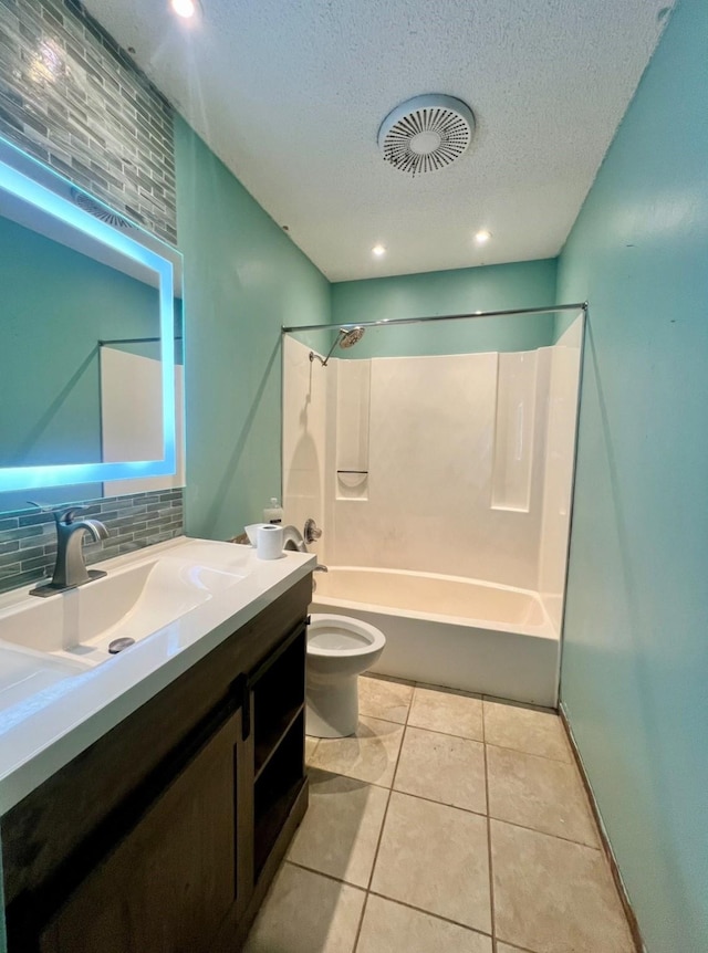 full bathroom featuring toilet, a textured ceiling, shower / bathing tub combination, vanity, and backsplash