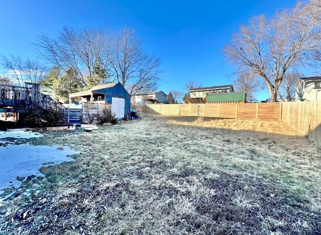 snowy yard with a shed