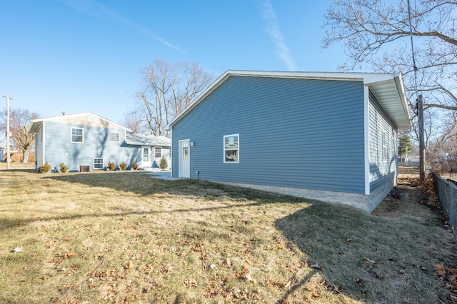 view of property exterior featuring a yard