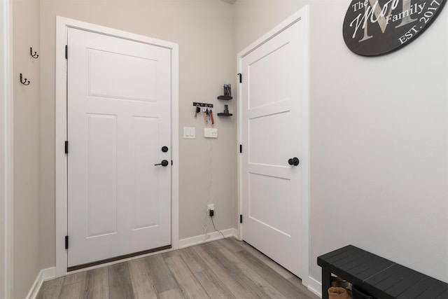 entryway with light hardwood / wood-style floors