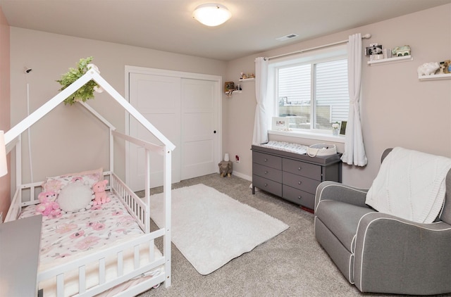 bedroom featuring light carpet