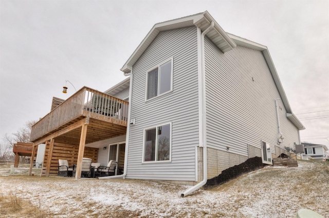 back of house featuring a deck