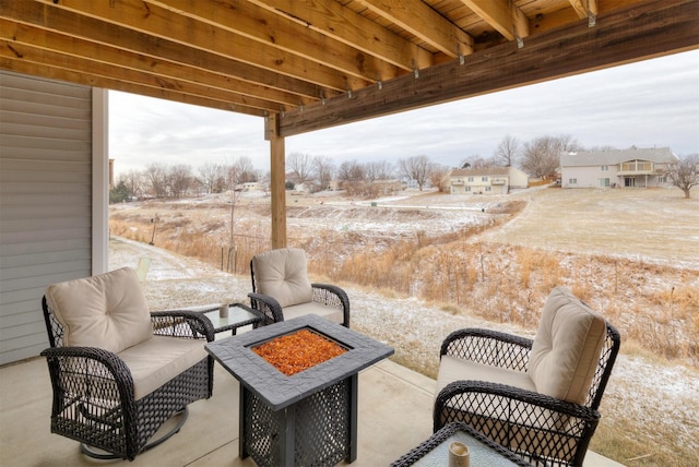 view of patio / terrace with an outdoor fire pit