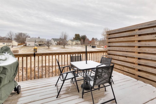 wooden terrace featuring a grill