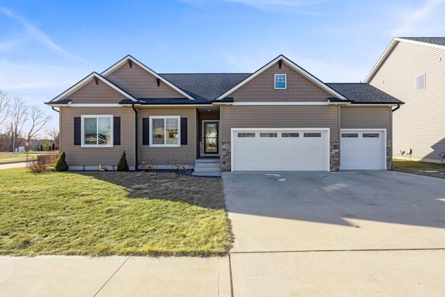 view of front facade featuring a garage and a front lawn