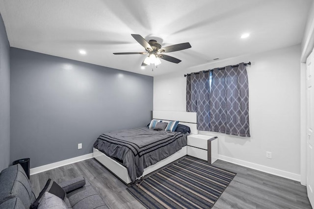 bedroom featuring dark hardwood / wood-style floors and ceiling fan