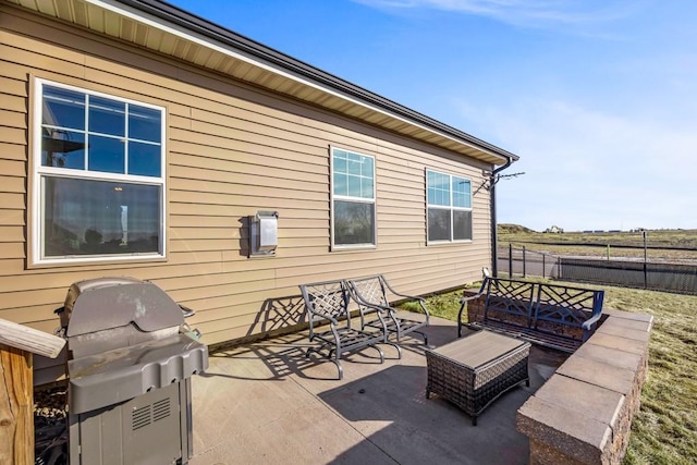 view of patio with grilling area and an outdoor living space