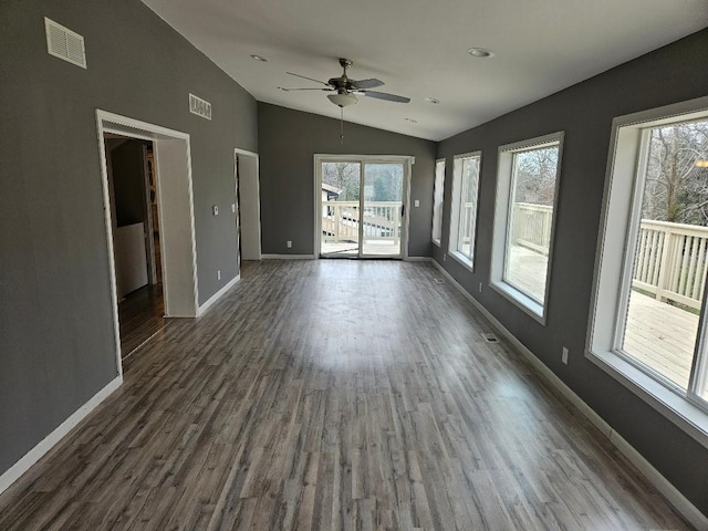 interior space with vaulted ceiling, dark hardwood / wood-style floors, and ceiling fan