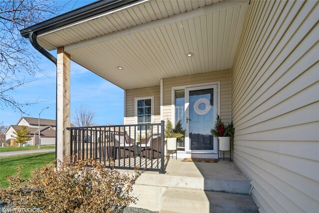 property entrance with covered porch