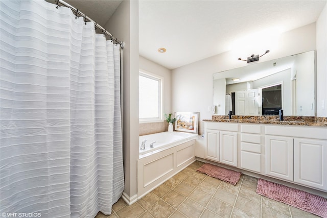 bathroom featuring vanity and a tub