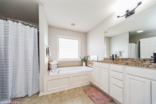 bathroom with vanity, a tub to relax in, and tile patterned floors