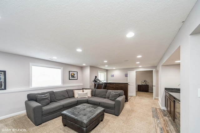 living room with sink and a textured ceiling