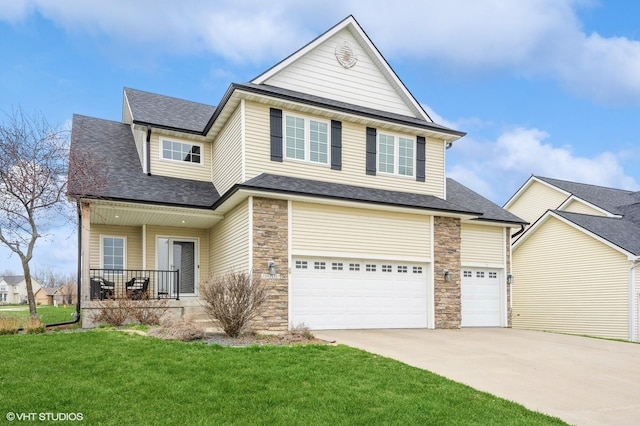 view of front facade with concrete driveway, roof with shingles, stone siding, an attached garage, and a front yard