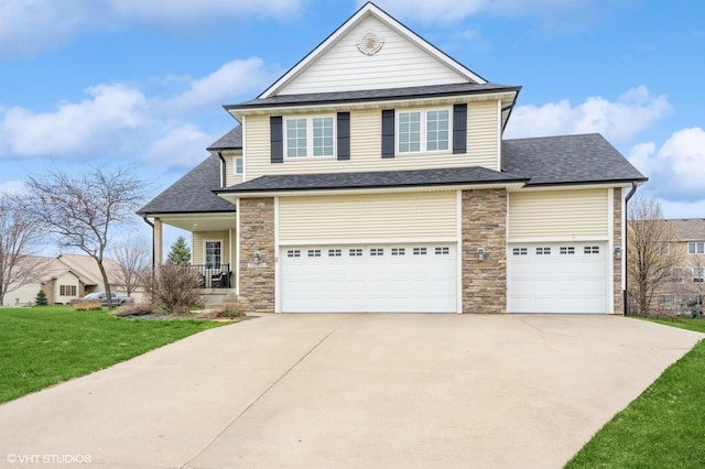 traditional-style house with roof with shingles, driveway, stone siding, and a front lawn