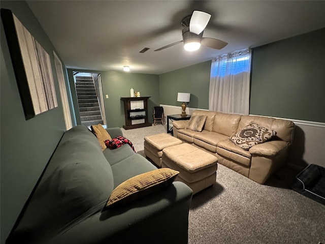 living room with ceiling fan and carpet flooring