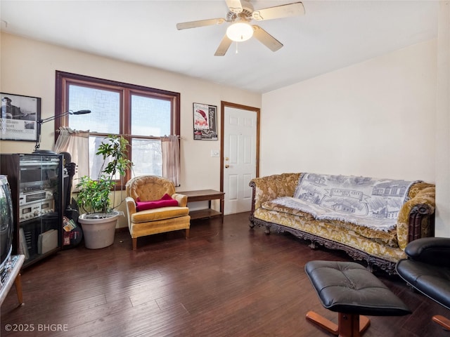 interior space with dark wood-type flooring and ceiling fan