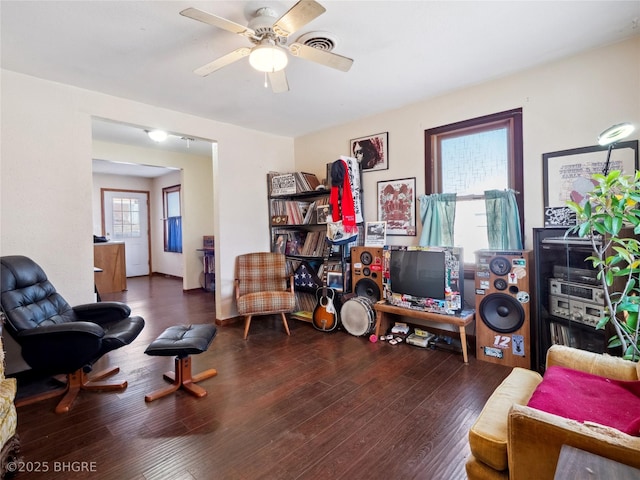 interior space with ceiling fan and dark hardwood / wood-style floors