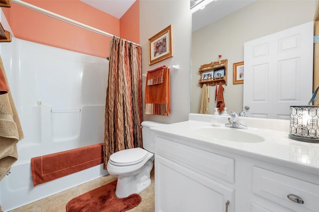 bathroom featuring tile patterned flooring, vanity, and toilet