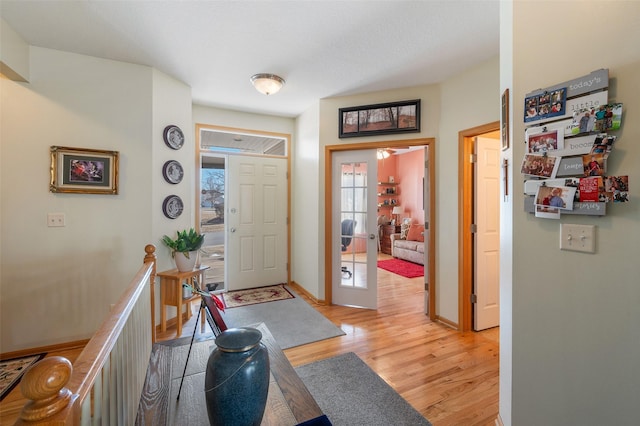 entrance foyer with light wood-type flooring and french doors