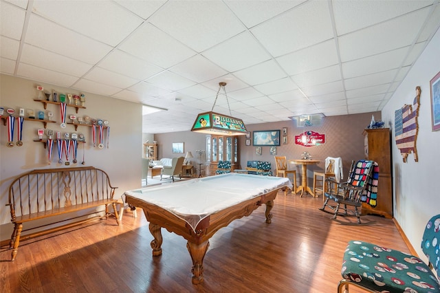 game room with a drop ceiling, wood-type flooring, and billiards