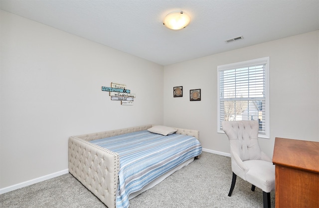 bedroom with visible vents, baseboards, and carpet floors